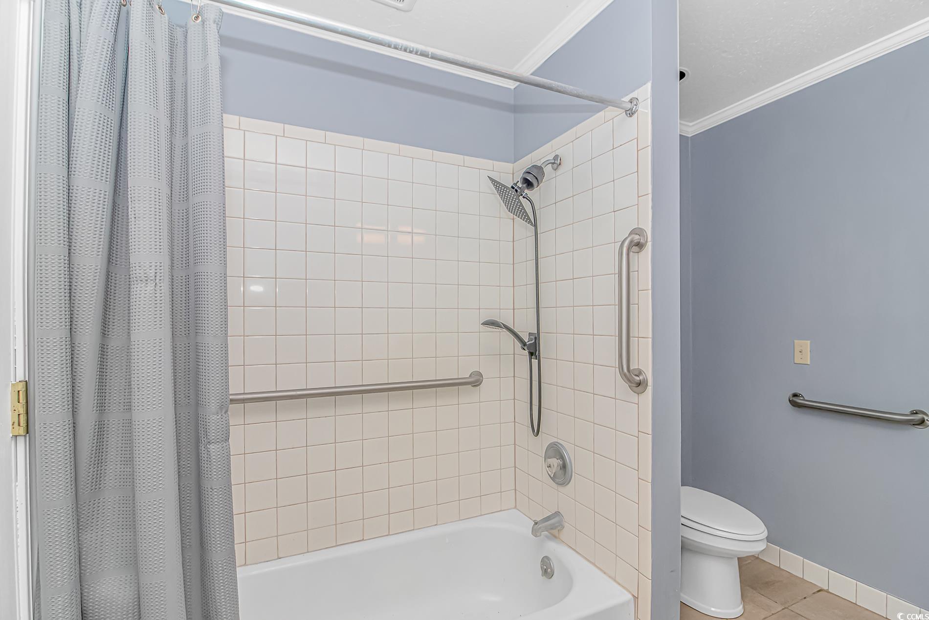 2829 Highway 129 Galivants Ferry, SC 29544 - Photo 14 of 40 Bathroom with shower / bath combo with shower curtain, crown molding, and tile patterned floors