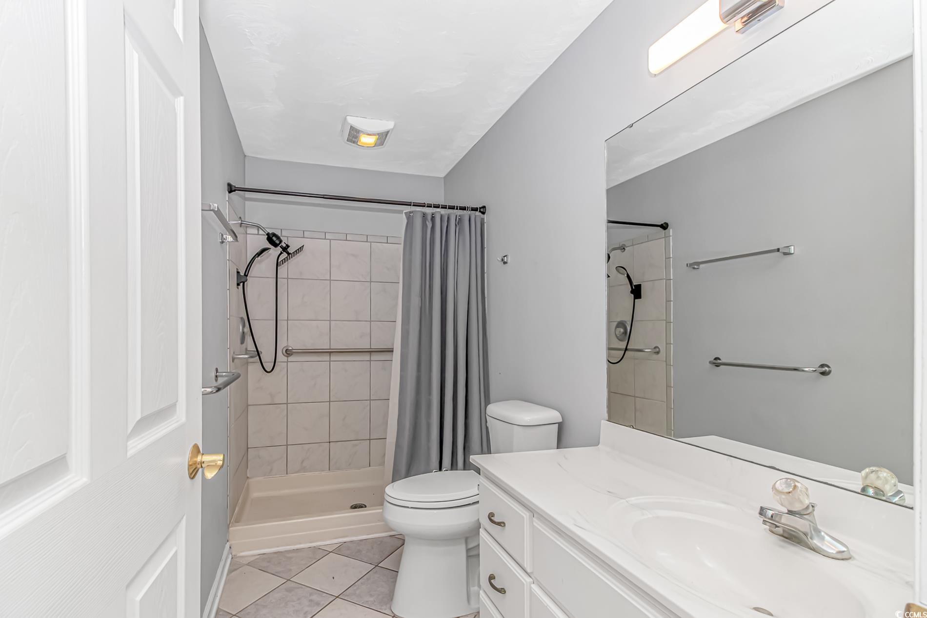 2829 Highway 129 Galivants Ferry, SC 29544 - Photo 20 of 40 Bathroom with vanity, tile patterned flooring, and tiled shower