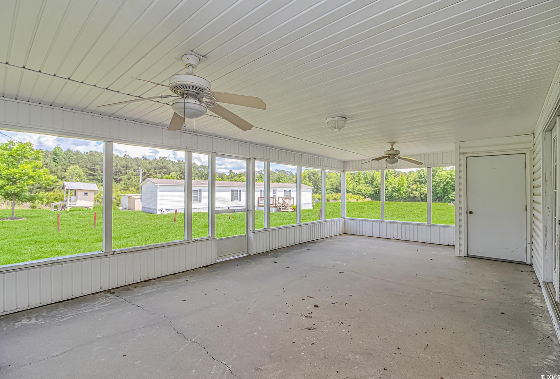 2829 Highway 129 Galivants Ferry, SC 29544 - Photo 21 of 40 Unfurnished sunroom with ceiling fan and plenty of natural light