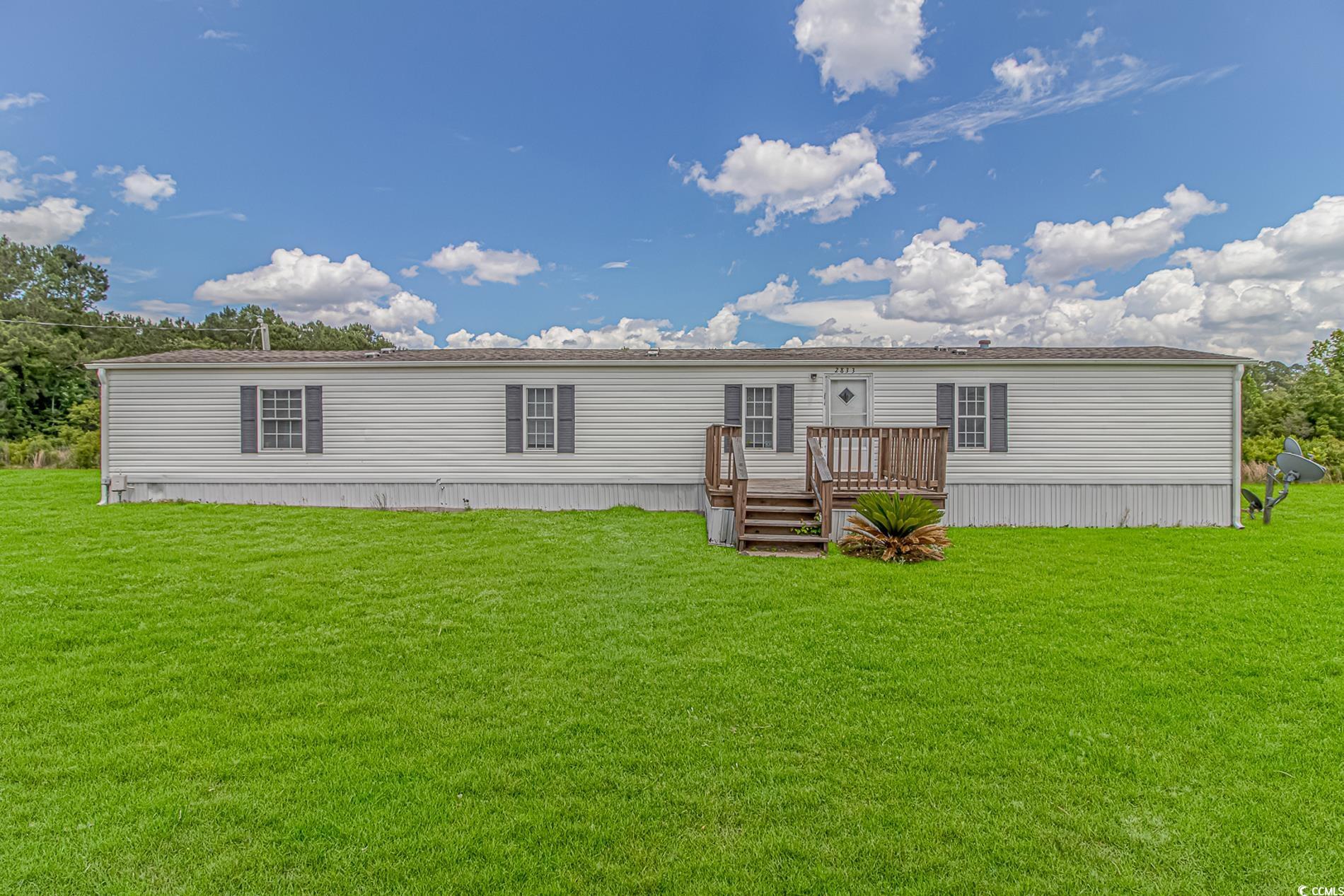 2829 Highway 129 Galivants Ferry, SC 29544 - Photo 25 of 40 Rear view of house with a wooden deck and a yard