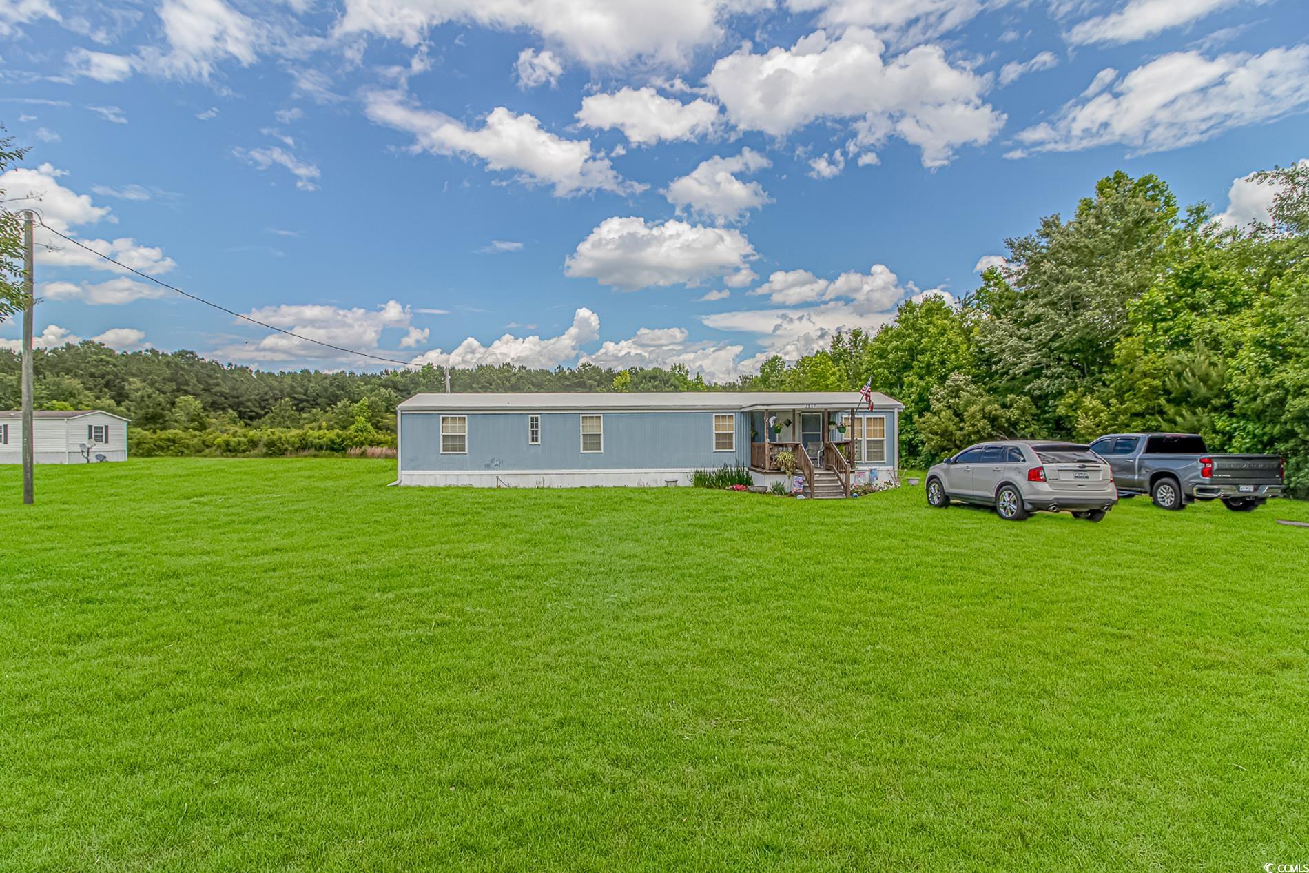 2829 Highway 129 Galivants Ferry, SC 29544 - Photo 35 of 40 Rear view of house featuring a lawn