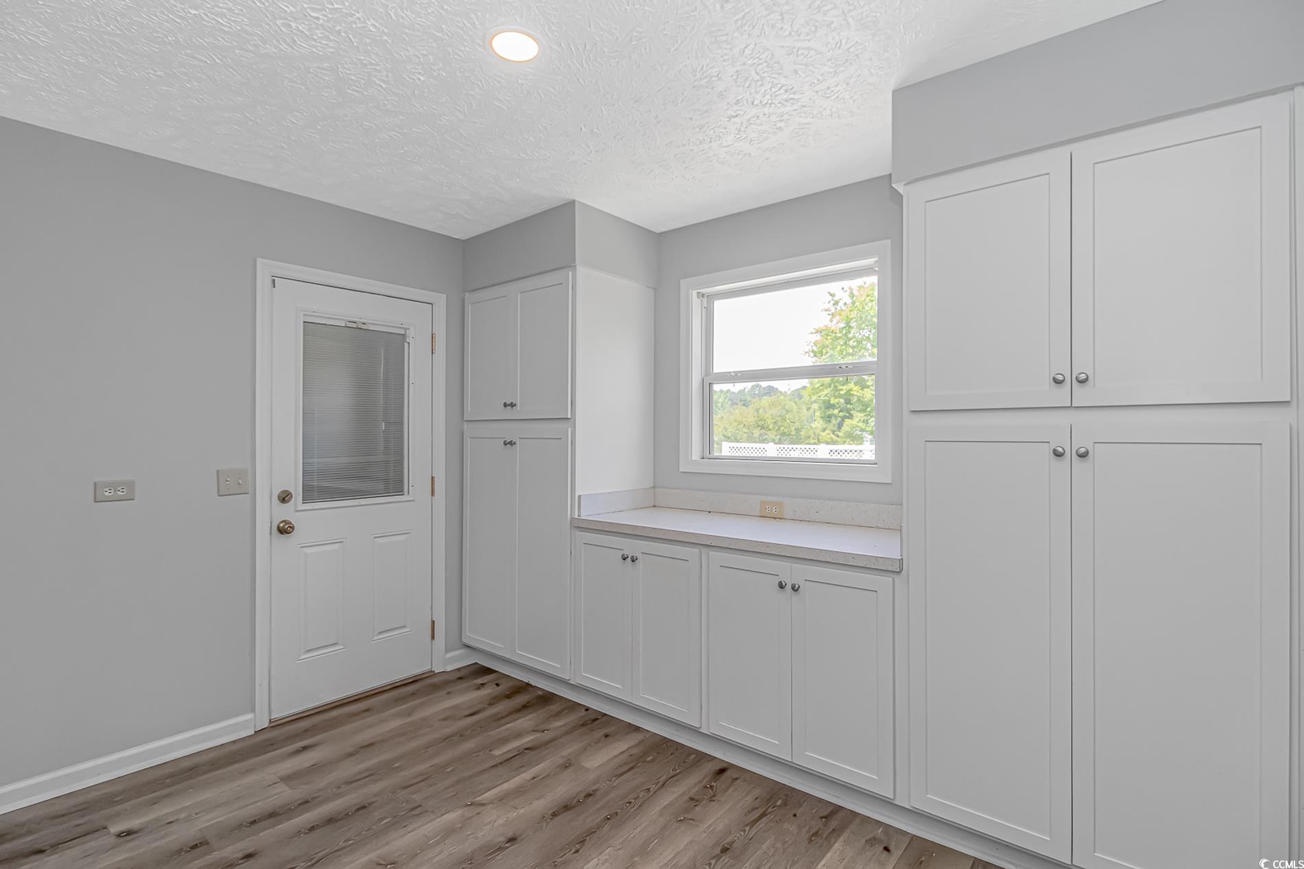 2829 Highway 129 Galivants Ferry, SC 29544 - Photo 9 of 40 Washroom featuring light wood-style floors and a textured ceiling