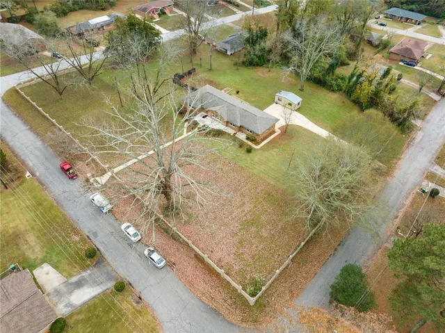 an aerial view of residential houses with outdoor space
