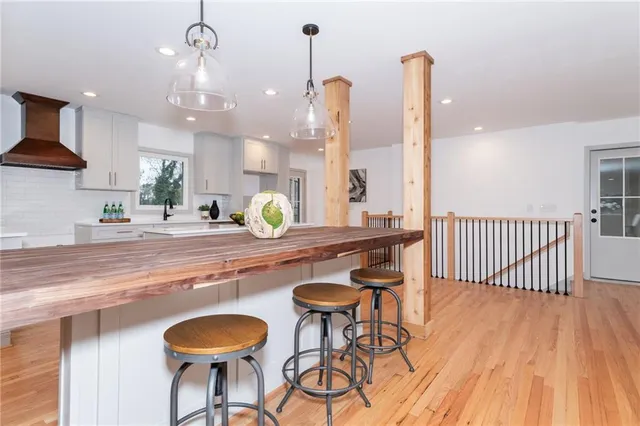 a view of kitchen with cabinets and wooden floor