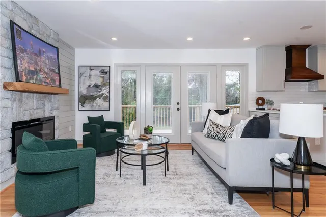 a living room with furniture and a fireplace