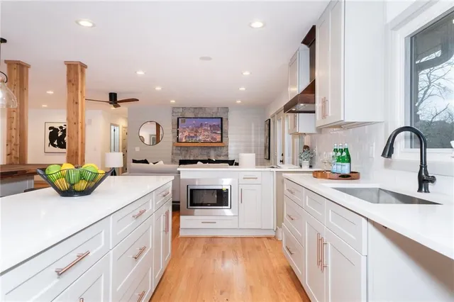 a kitchen with a sink and cabinets