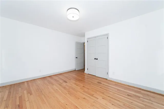 a view of a room with wooden floor