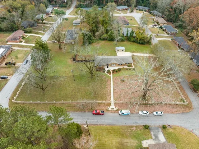 an aerial view of residential houses with outdoor space