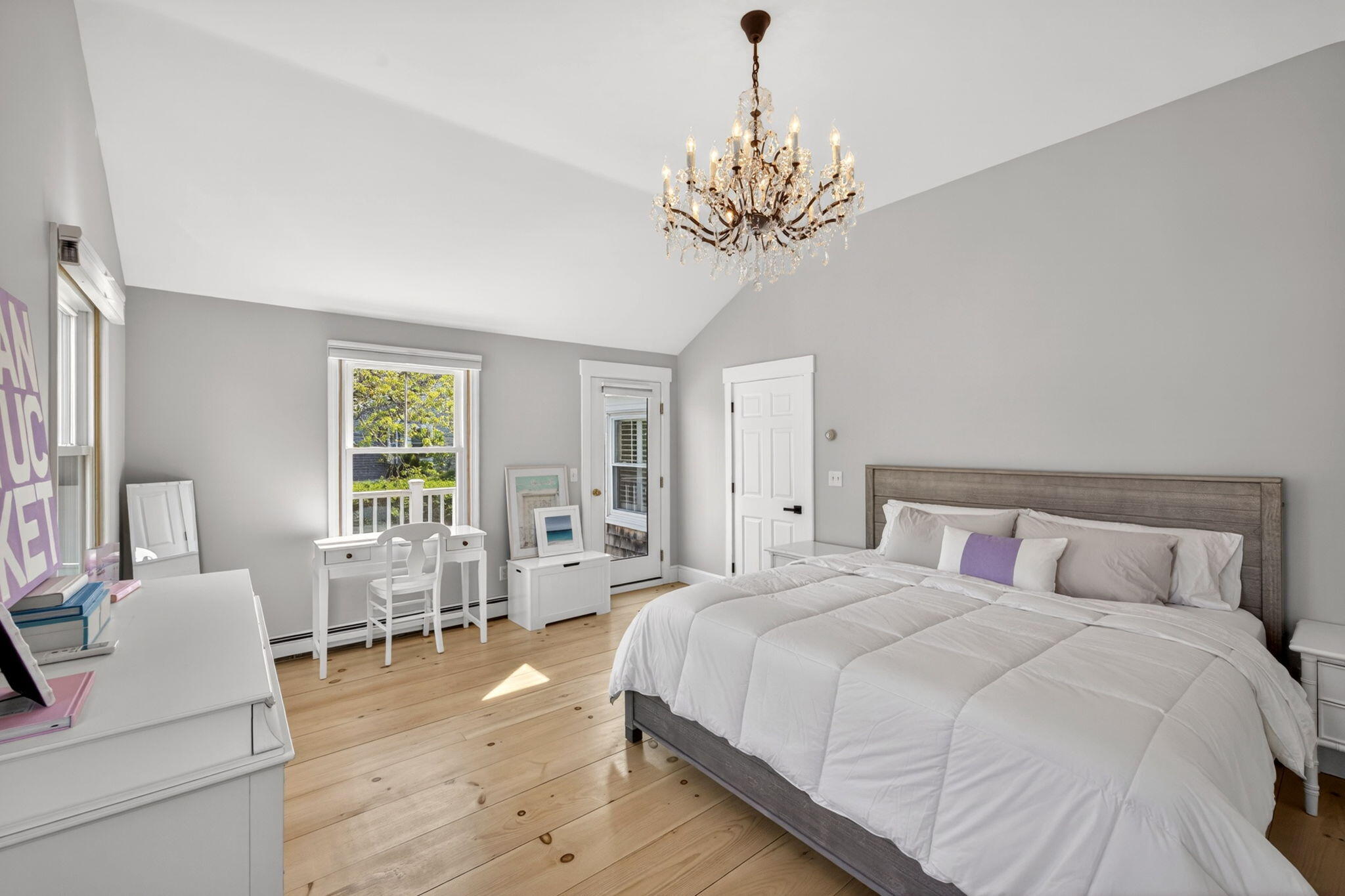 320 Old Harbor Road Chatham, MA 02633 - Photo 41 of 58 a bedroom with a large bed and a chandelier
