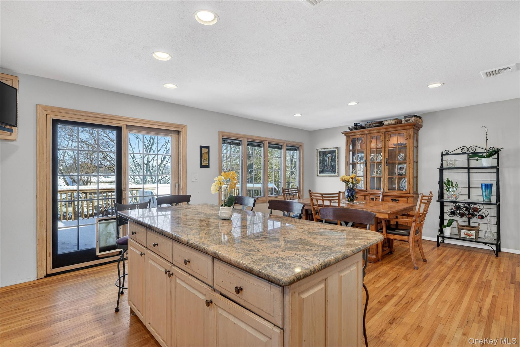 5 Raleigh Drive New City, NY 10956 - Photo 10 of 44 a kitchen with stainless steel appliances granite countertop a stove top oven a sink dishwasher and wooden cabinets with wooden floor