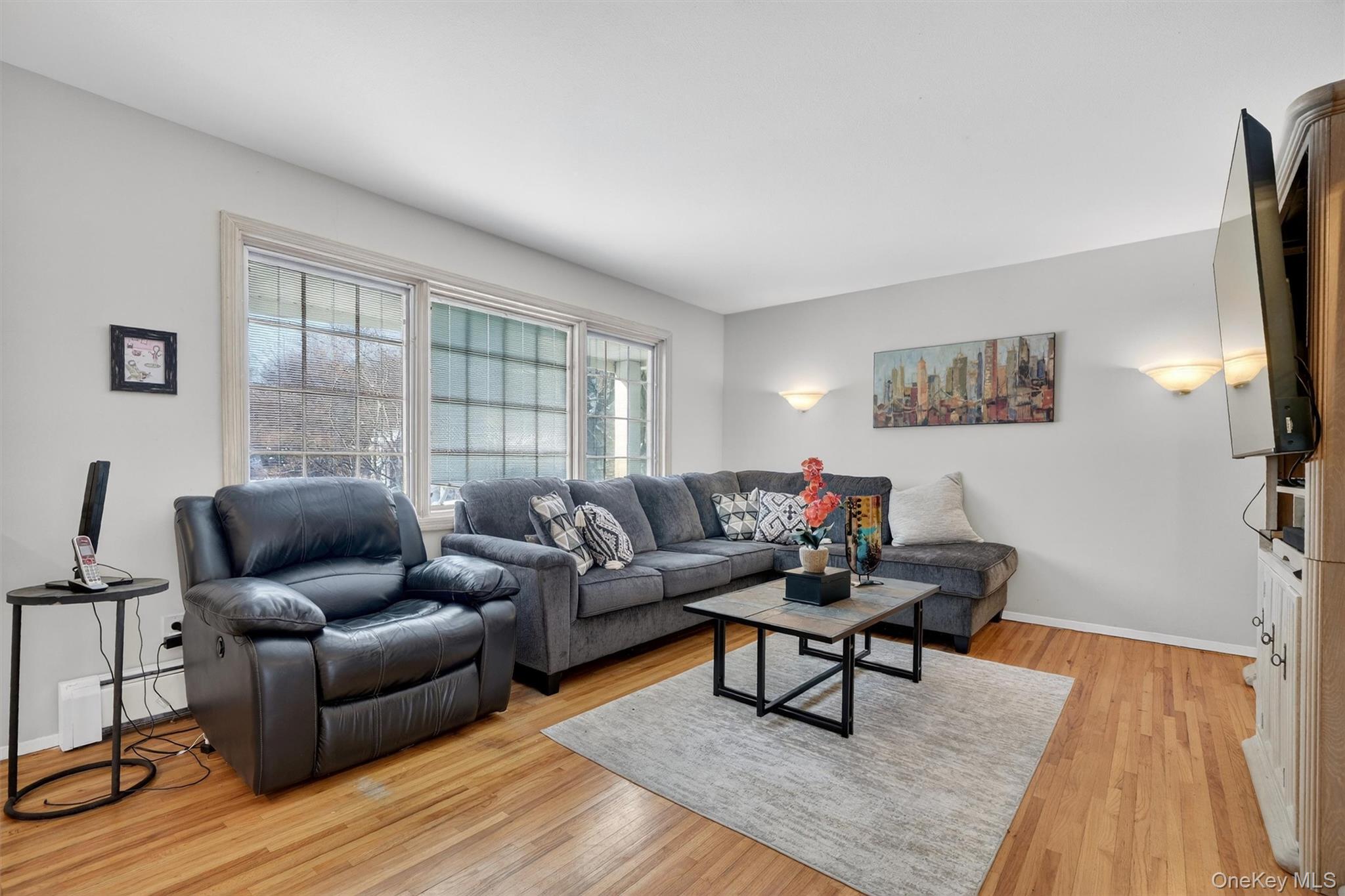 5 Raleigh Drive New City, NY 10956 - Photo 17 of 44 a living room with furniture and a wooden floor