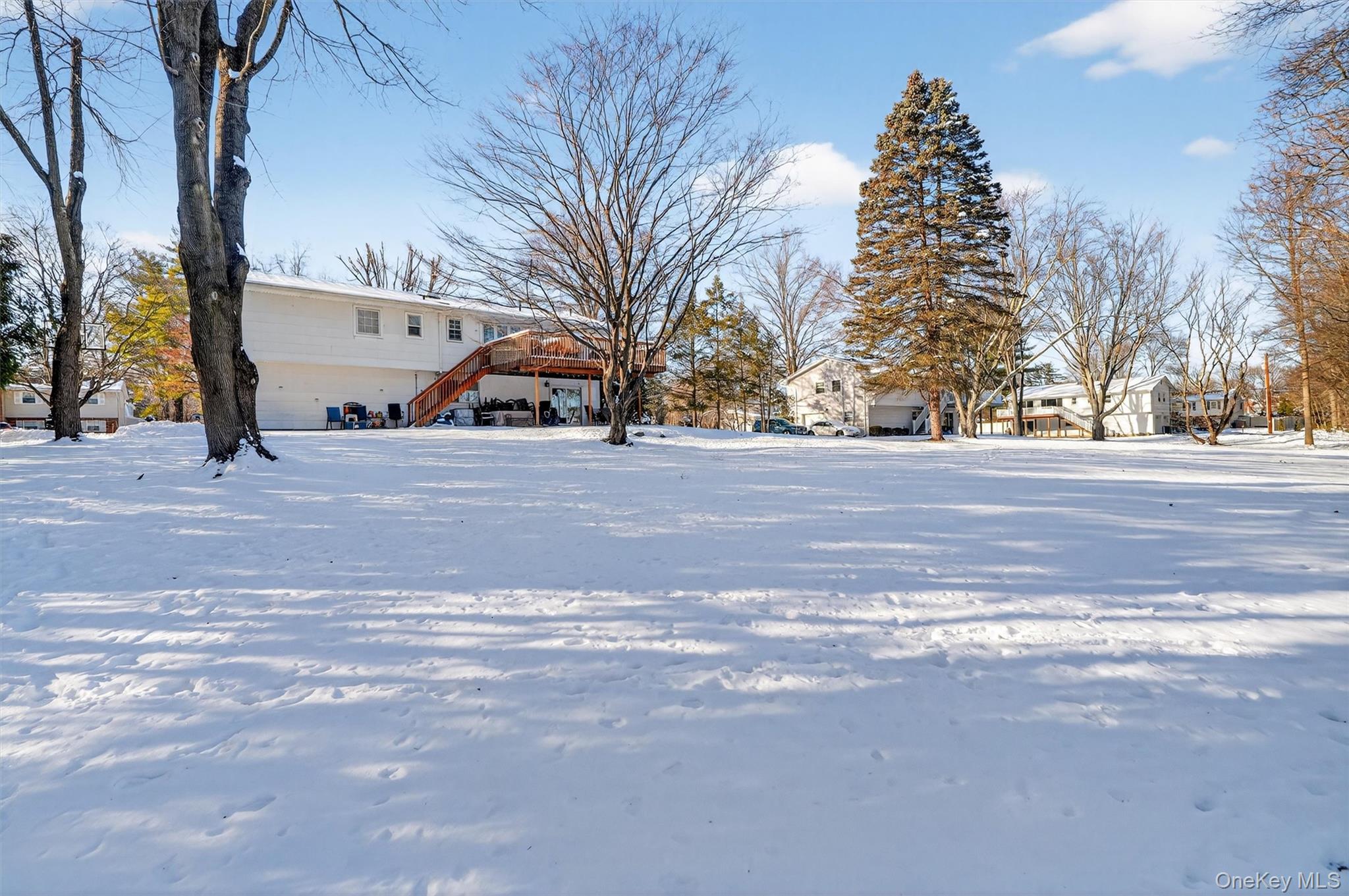 5 Raleigh Drive New City, NY 10956 - Photo 2 of 44 a view of a house with a yard and garage