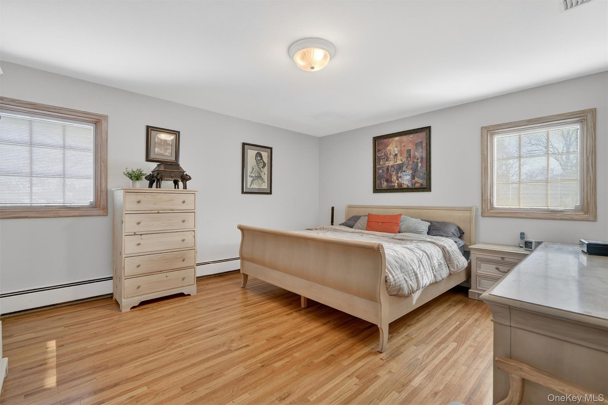 5 Raleigh Drive New City, NY 10956 - Photo 20 of 44 a spacious bedroom with a bed and cabinet