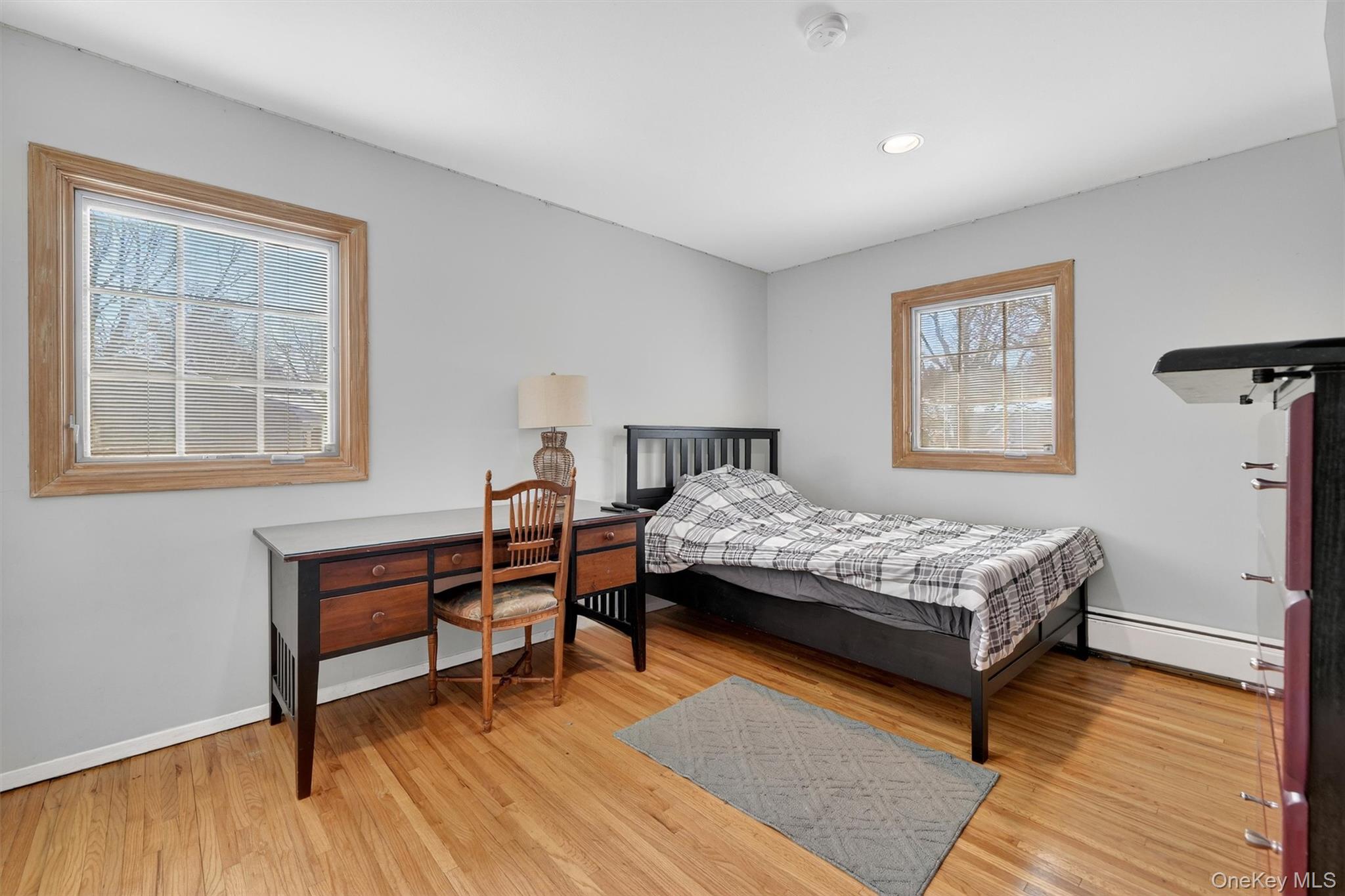 5 Raleigh Drive New City, NY 10956 - Photo 23 of 44 a bedroom with a bed and a table in it