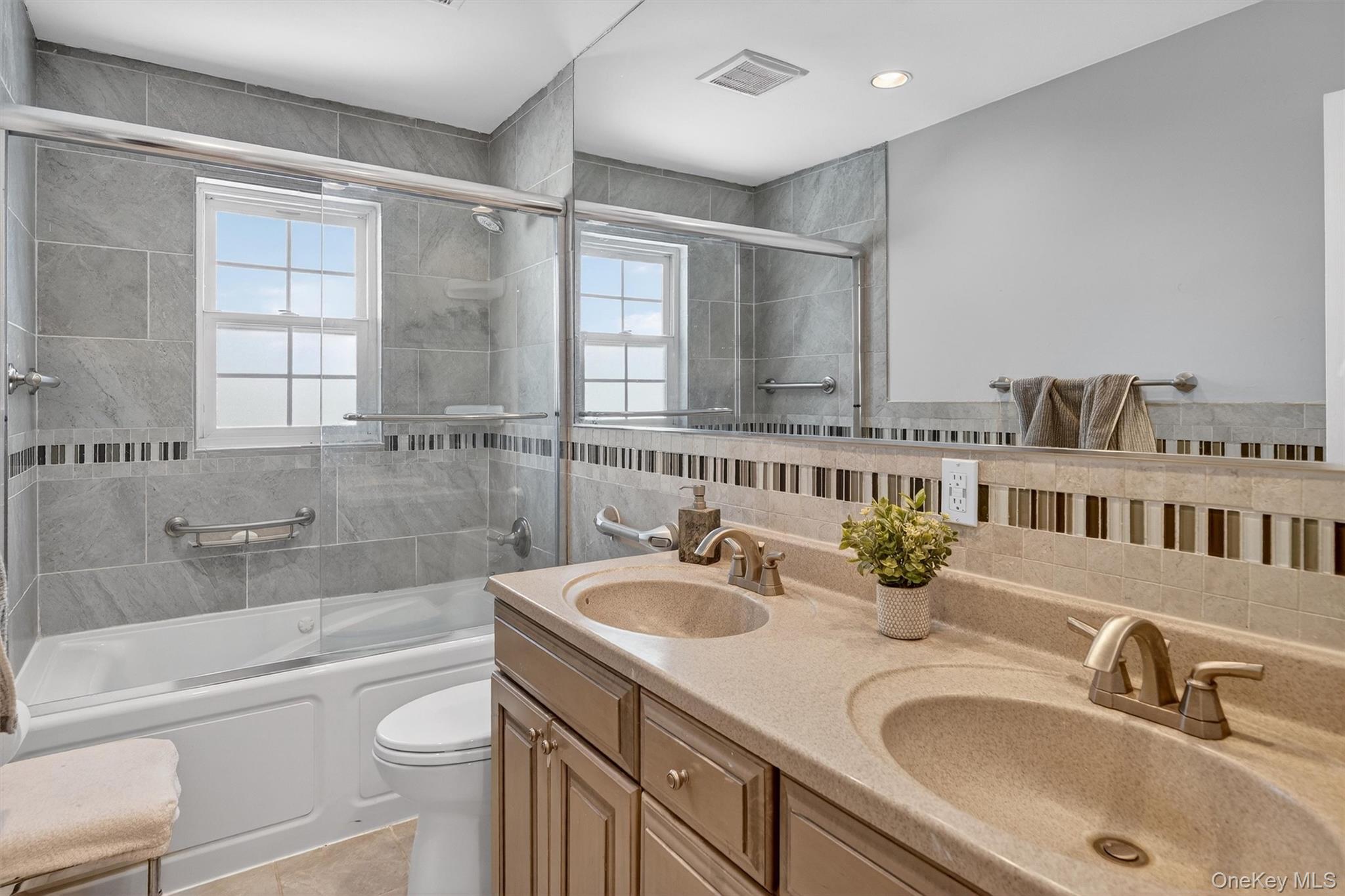 5 Raleigh Drive New City, NY 10956 - Photo 24 of 44 a bathroom with a sink a toilet and bathtub