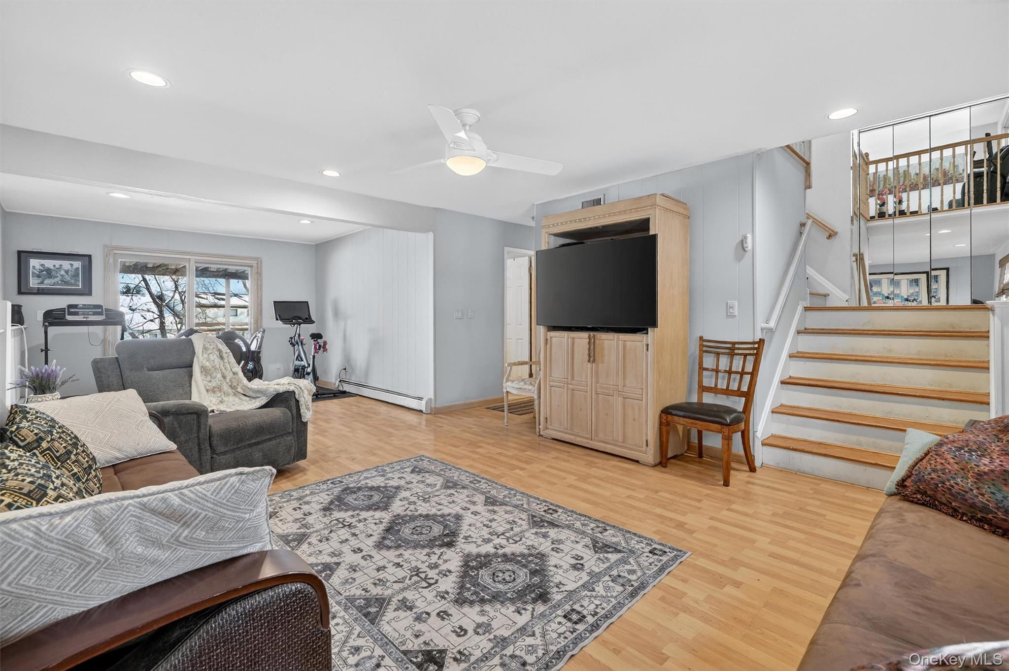 5 Raleigh Drive New City, NY 10956 - Photo 26 of 44 a living room with furniture and a flat screen tv