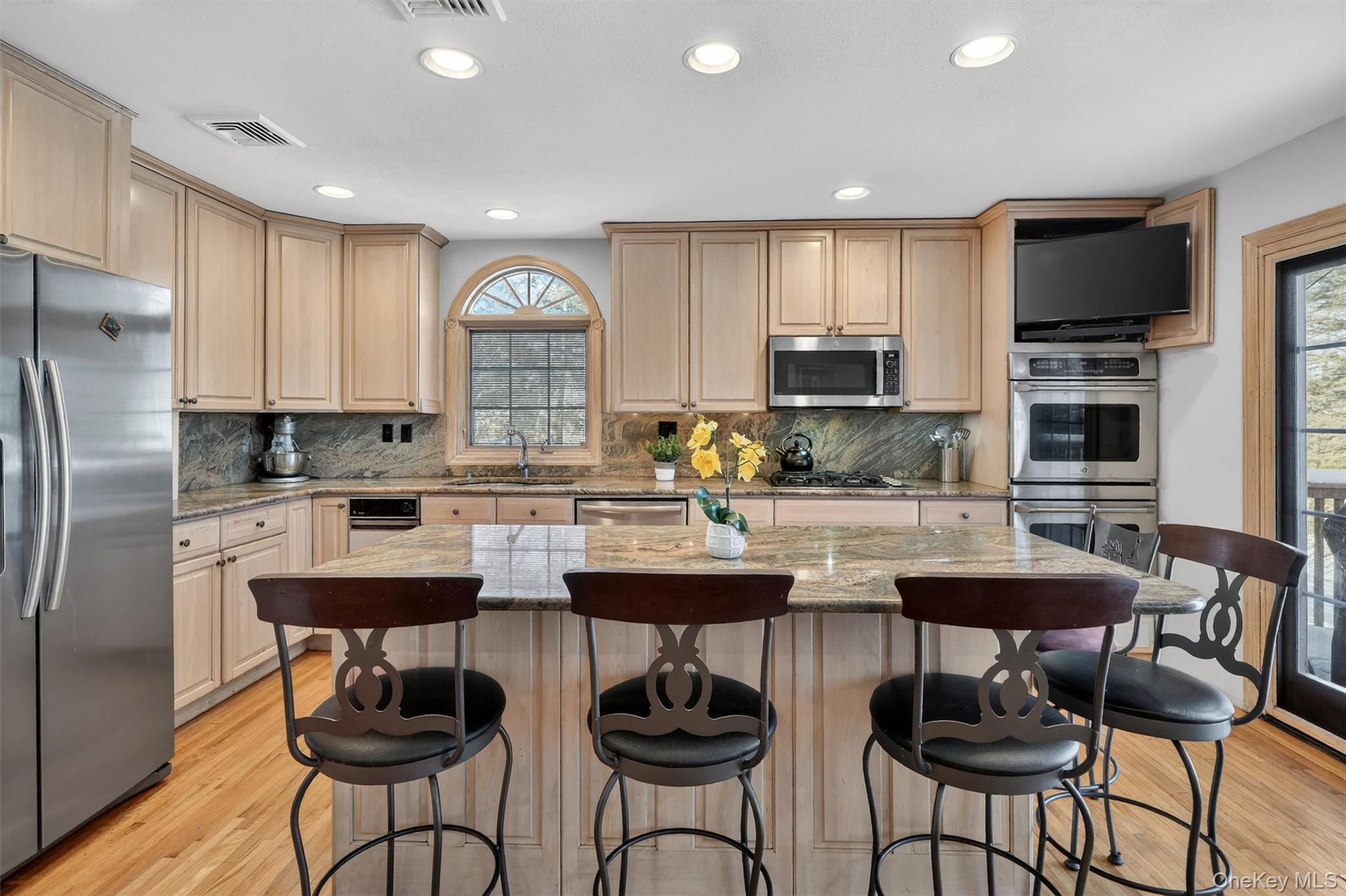 5 Raleigh Drive New City, NY 10956 - Photo 7 of 44 a kitchen with stainless steel appliances granite countertop a table and chairs in it