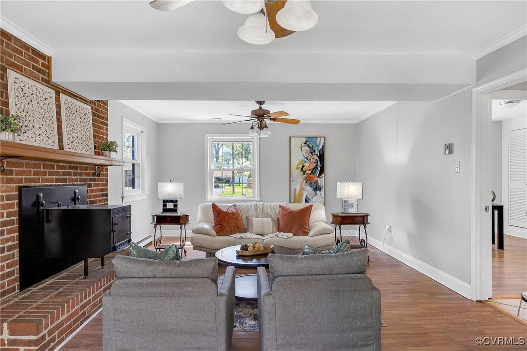 8202 Colebrook Road Richmond, VA 23227 - Photo 13 of 25 Living area with baseboards, crown molding, wood f