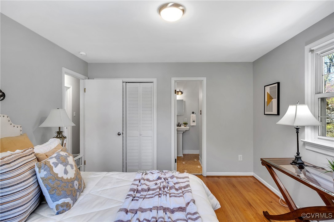 8202 Colebrook Road Richmond, VA 23227 - Photo 18 of 25 Bedroom featuring a closet, baseboards, ensuite ba