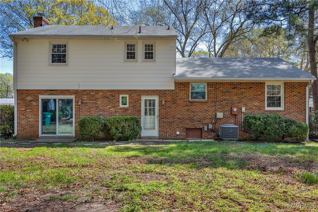 8202 Colebrook Road Richmond, VA 23227 - Photo 24 of 25 Rear view of house with cooling unit, roof with sh