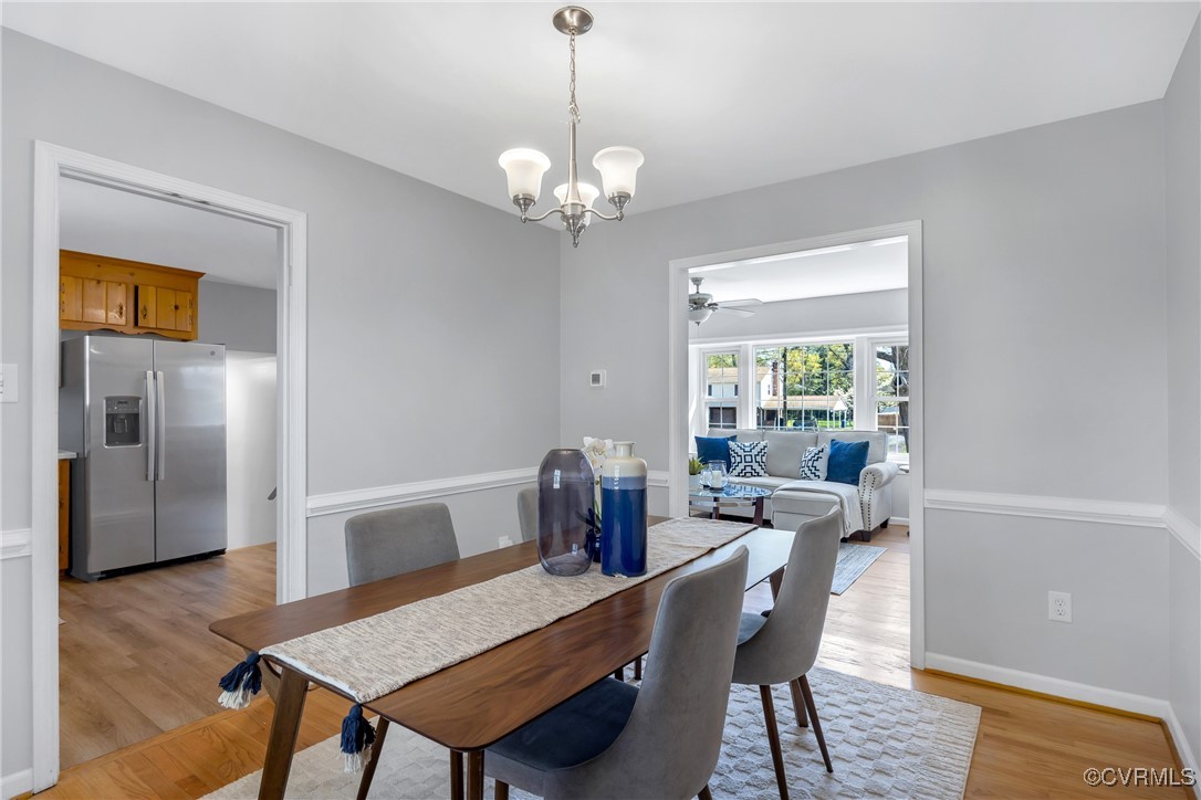 Dining space featuring baseboards, light wood-type