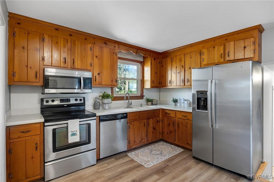 8202 Colebrook Road Richmond, VA 23227 - Photo 8 of 25 Kitchen featuring light countertops, a sink, appli