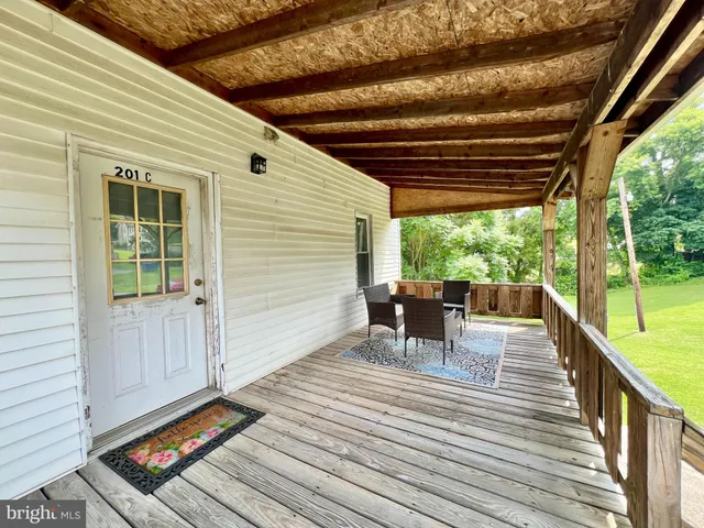 a view of a patio with wooden floor