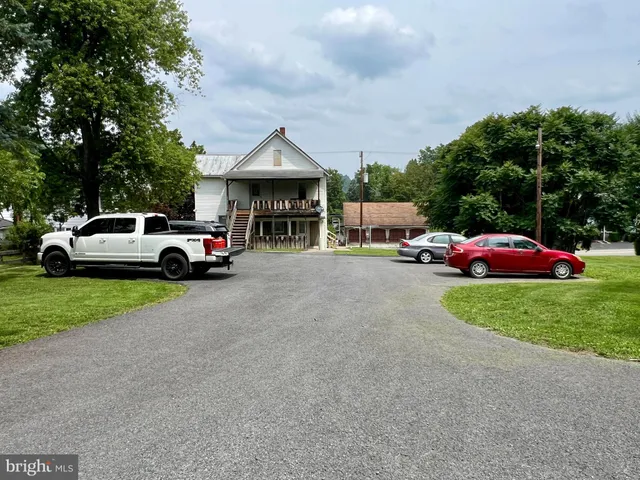 a view of street with parked cars