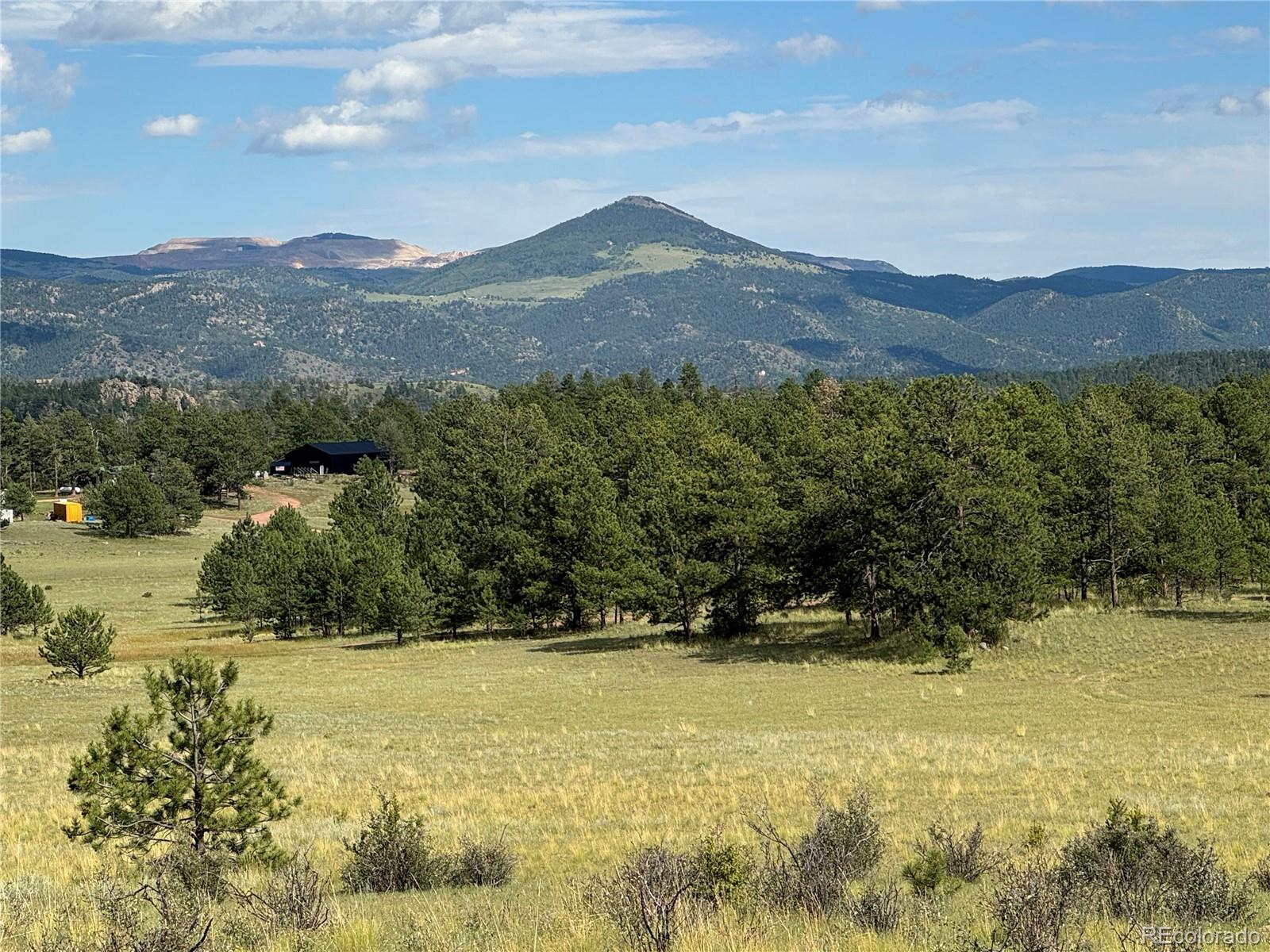 Twinkle Road Guffey, CO 80820 - Photo 3 of 32 a view of a lake with mountains in the background