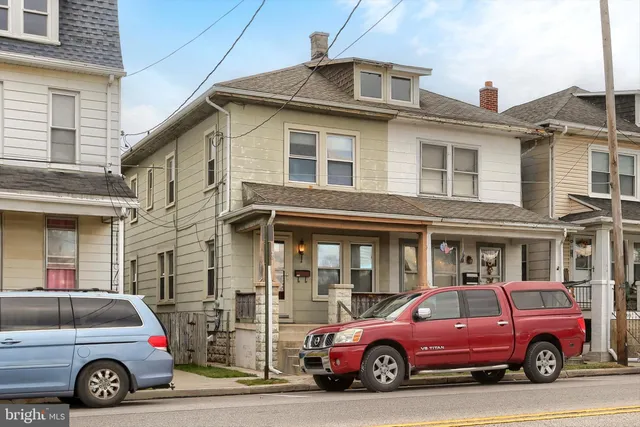 a view of a car parked in front of a building