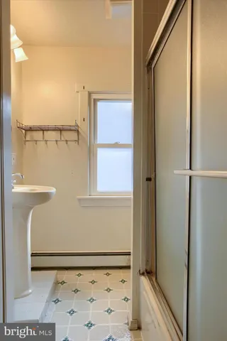 a view of an empty room and a window