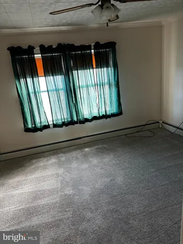 a view of an empty room and window