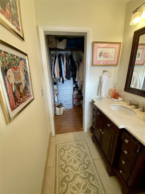 2755 Northeast 28th Avenue, Unit E3 Lighthouse Point, FL 33064 - Photo 11 of 48 a bathroom with a double vanity sink and a mirror
