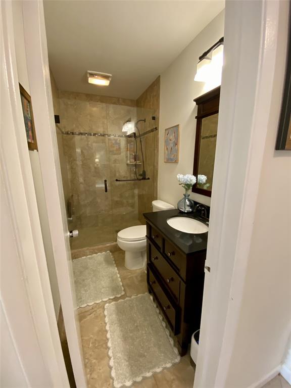 2755 Northeast 28th Avenue, Unit E3 Lighthouse Point, FL 33064 - Photo 12 of 48 a bathroom with a sink and a mirror