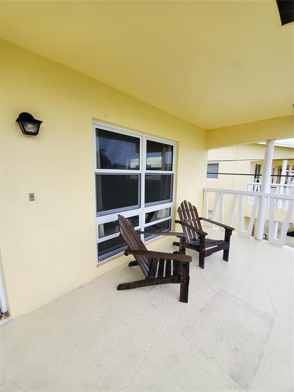2755 Northeast 28th Avenue, Unit E3 Lighthouse Point, FL 33064 - Photo 15 of 48 a view of a workspace with a window and sitting area