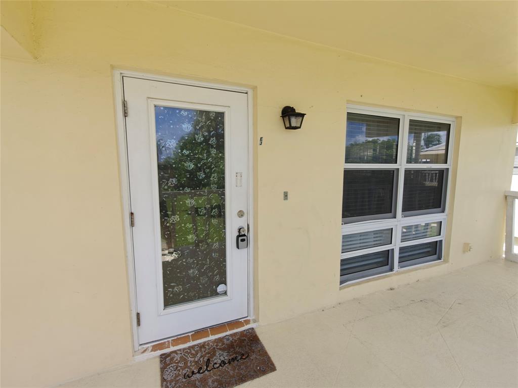 2755 Northeast 28th Avenue, Unit E3 Lighthouse Point, FL 33064 - Photo 19 of 48 a view of front door