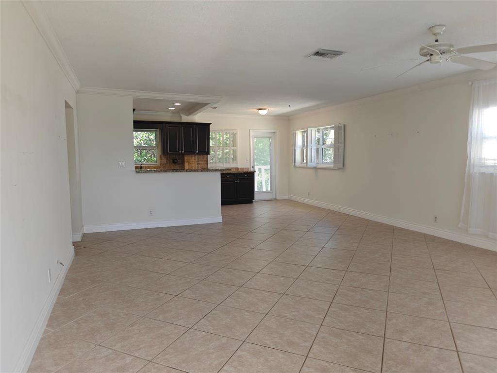 2755 Northeast 28th Avenue, Unit E3 Lighthouse Point, FL 33064 - Photo 21 of 48 an empty room with kitchen view and a window