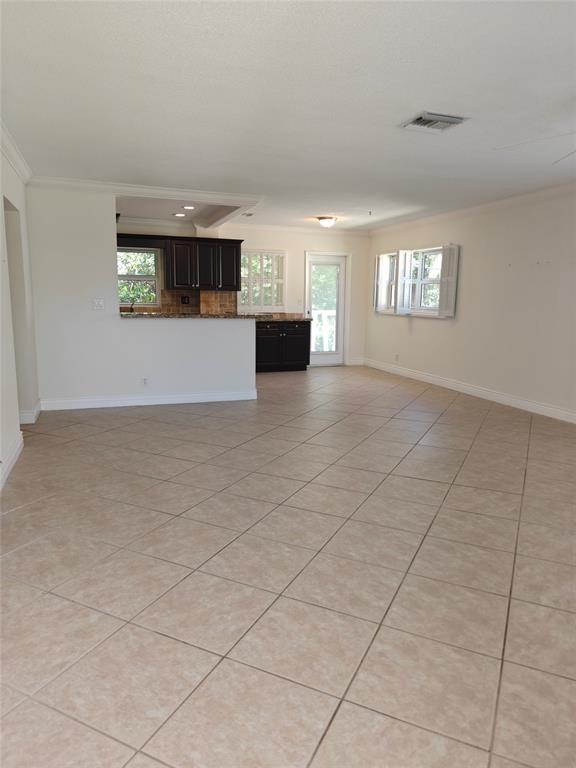 2755 Northeast 28th Avenue, Unit E3 Lighthouse Point, FL 33064 - Photo 22 of 48 an empty room with windows and fireplace