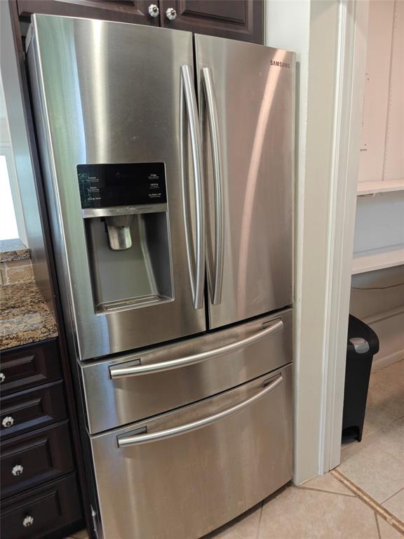 2755 Northeast 28th Avenue, Unit E3 Lighthouse Point, FL 33064 - Photo 27 of 48 an empty refrigerator freezer sitting inside of a kitchen