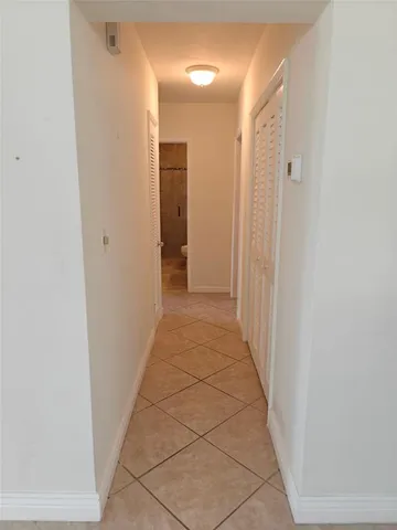 a bathroom with a double vanity sink toilet mirror and shower