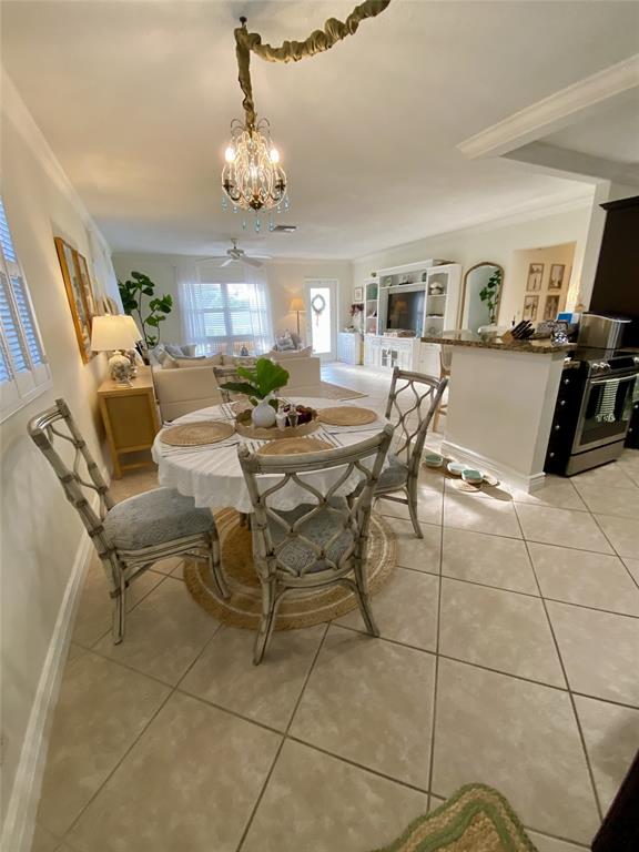 2755 Northeast 28th Avenue, Unit E3 Lighthouse Point, FL 33064 - Photo 4 of 48 a view of a livingroom and dining room