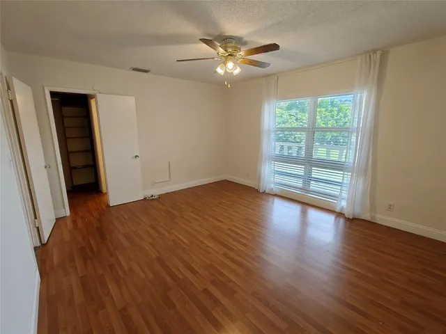 a bathroom with a sink vanity mirror and toilet