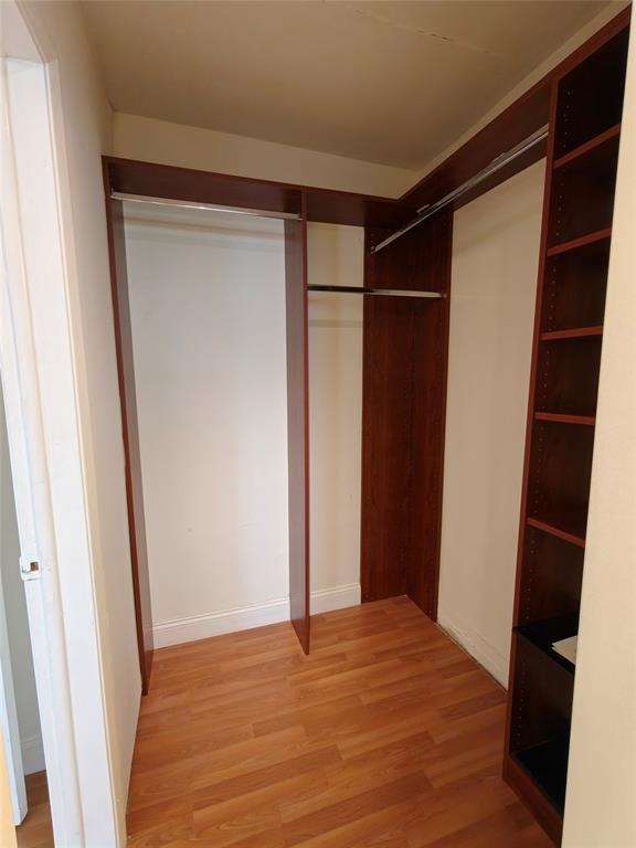 2755 Northeast 28th Avenue, Unit E3 Lighthouse Point, FL 33064 - Photo 43 of 48 a view of empty room with wooden floor