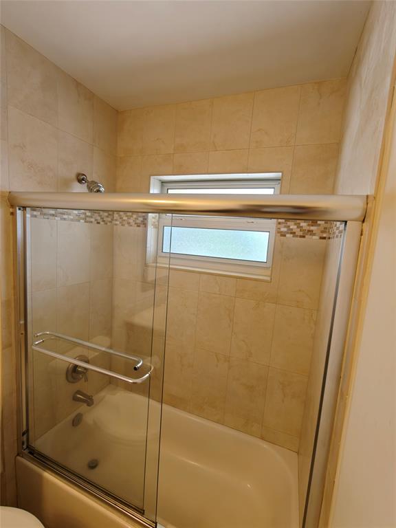 2755 Northeast 28th Avenue, Unit E3 Lighthouse Point, FL 33064 - Photo 46 of 48 a bathroom with a shower