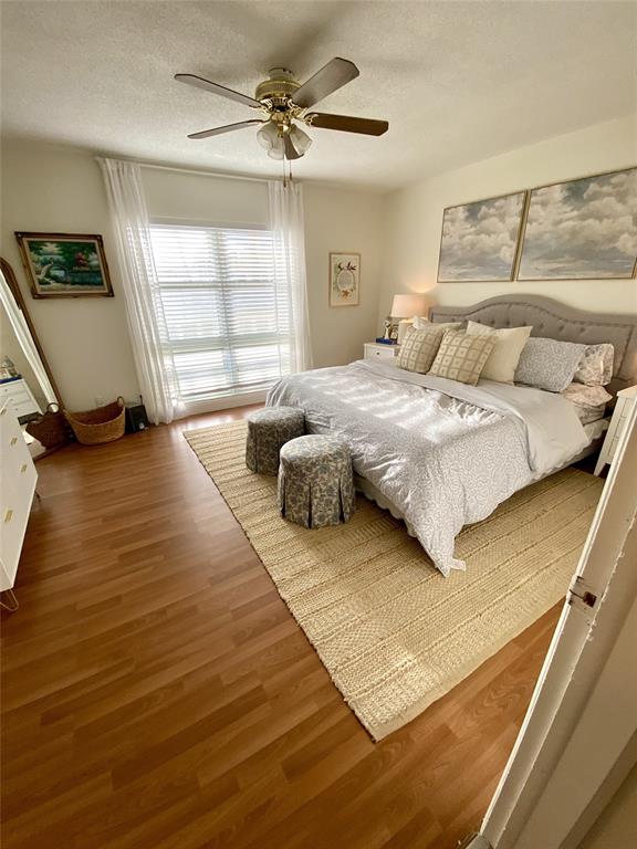 2755 Northeast 28th Avenue, Unit E3 Lighthouse Point, FL 33064 - Photo 8 of 48 a bedroom with a bed a couch and window