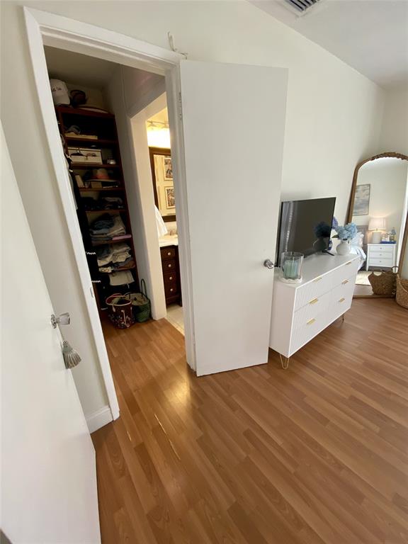2755 Northeast 28th Avenue, Unit E3 Lighthouse Point, FL 33064 - Photo 9 of 48 a view of a livingroom with wooden floor and furniture