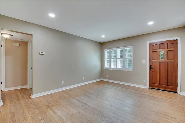 a kitchen with white cabinets stainless steel appliances and sink