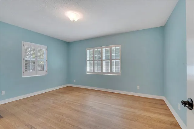 a bathroom with a sink toilet vanity and shower