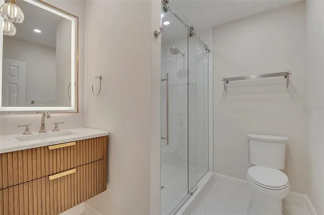 a bathroom with a sink a mirror and a shower