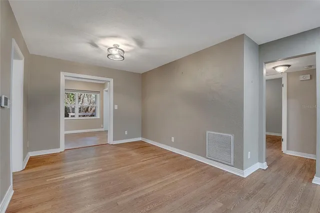 a view of an empty room with a window